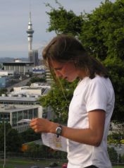 Lady looking at map with Auckland Sky Tower in background